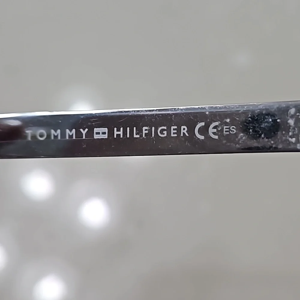 Tommy Hilfiger yellow and brown plastic frame glasses with case.